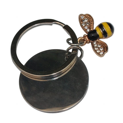 Keychain with bee-shaped charm on a light gray background