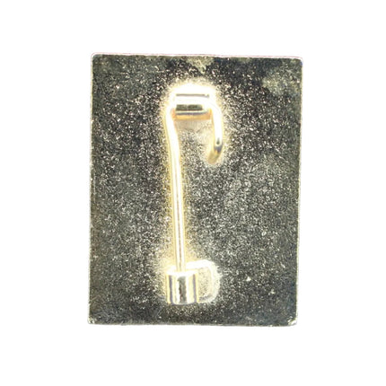 Gold key-shaped object on a blue textured background