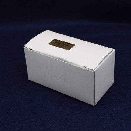 White box with a gold label on a dark blue background