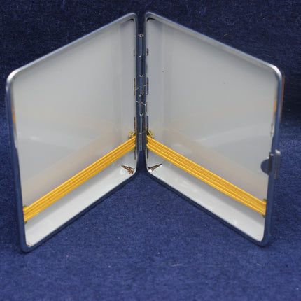 Open metallic case with yellow interior on a blue background