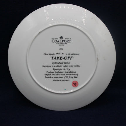 White Coalport plate with engraved text on a black background