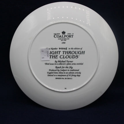 White Coalport plate with engraved text on a black background