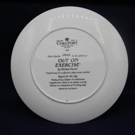 White Coalport plate with engraved text on a black background