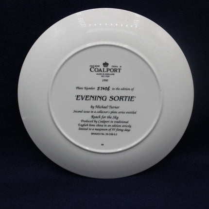 White Coalport plate with engraved text on a black background