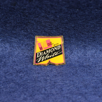 Vintage Diamond White badge with bold yellow design and slogan