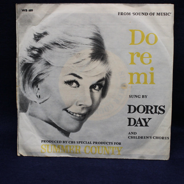 Record cover with Doris Day's face and text about 'Do re mi' from 'Sound of Music'.