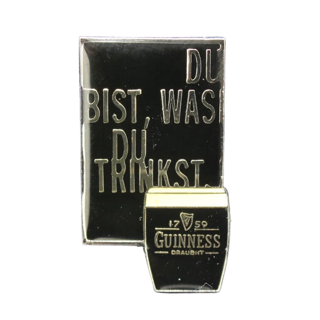 Guinness beer bottle cap with German text on a textured blue background