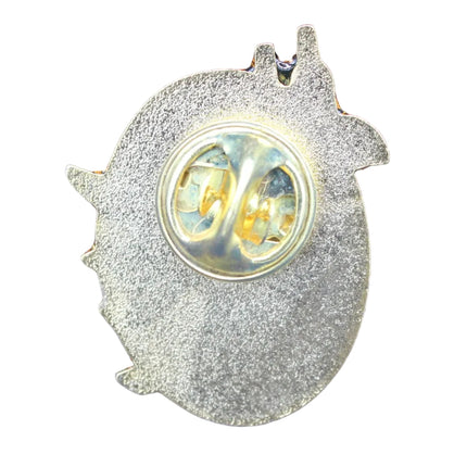 Metallic pin with on a white textured background