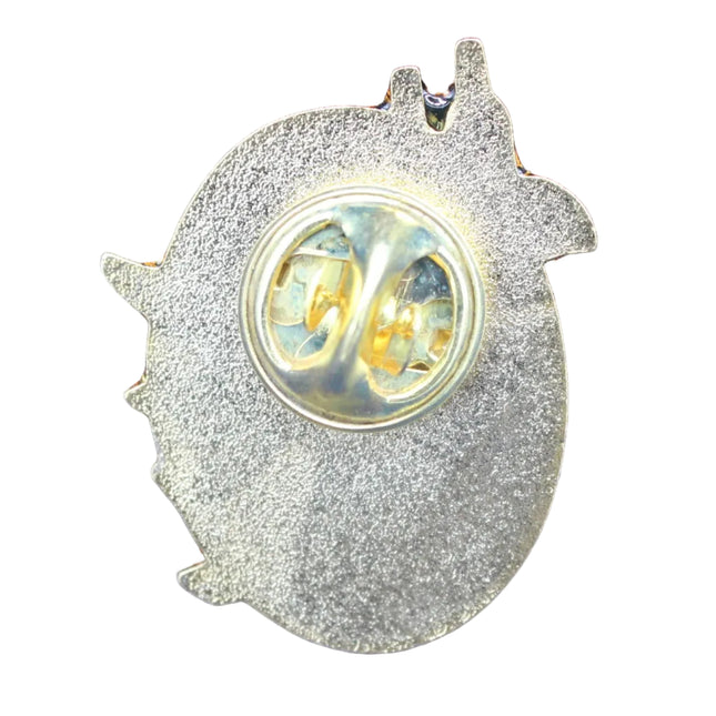 Metallic pin with on a white textured background