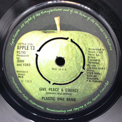 Record label with a green apple design and text