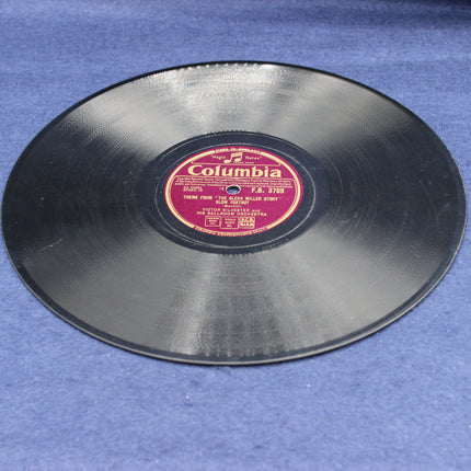 Vinyl record with a Columbia label on a blue surface