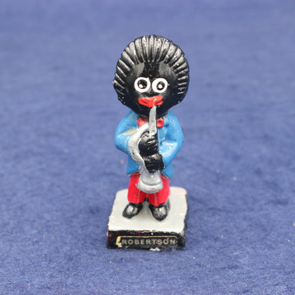 Golliy figurine with a blue outfit and red shoes on a blue background
