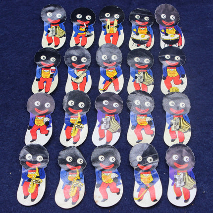 Set of 20 small Golly with black faces, red clothing, and musical instruments on a blue background.