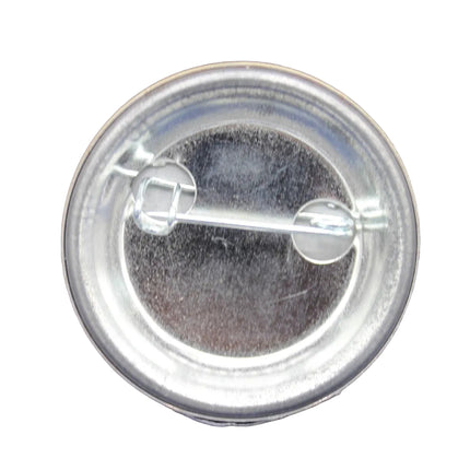 Clear button badge on a blue fabric background
