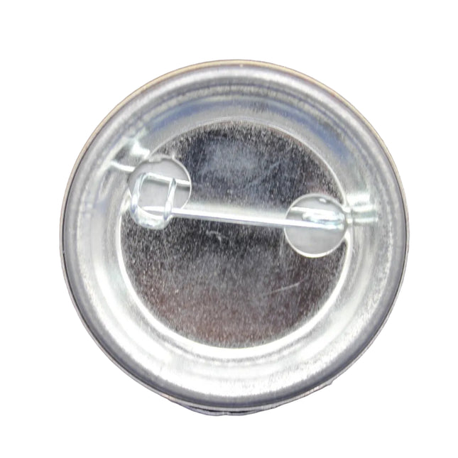 Clear button badge on a blue fabric background