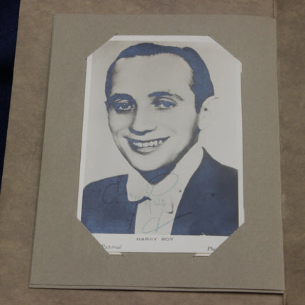 Vintage portrait of Harry Roy in a suit on a beige background