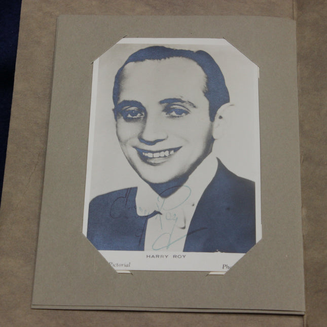 Vintage portrait of Harry Roy in a suit on a beige background