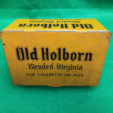 Rare Collectible Vintage Old Holburn Tobacconists Tin on a green background