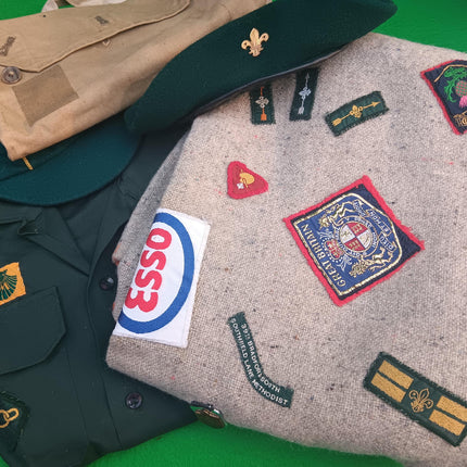 Vintage Boy Scout Memorabilia on a green background