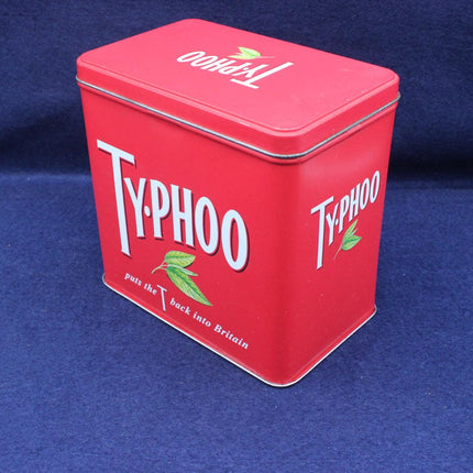 Front view of a red tea caddy tin