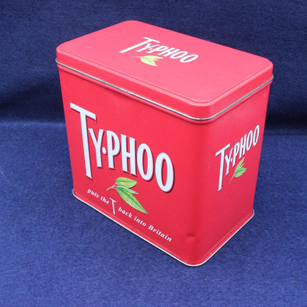 Red Typhoo tea tin on a blue background