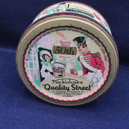 Round tin with 'Quality Street' branding on a blue background