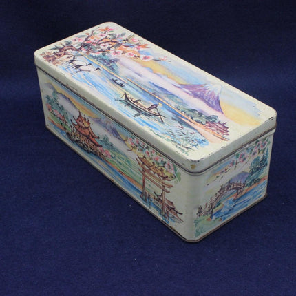 Decorative tin box with artistic design on a blue background
