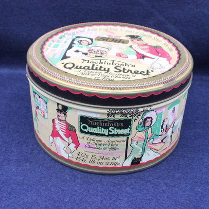 Mackintosh's Quality Street tin on a blue background