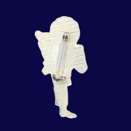 Karate Golly Pin Badge on a felt background