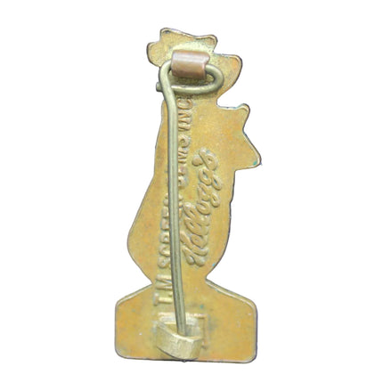 Gold-colored thermometer-shaped object on a blue background