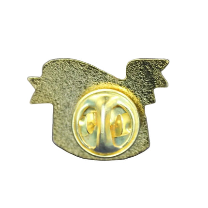 Gold pin with a logo on a blue textured background