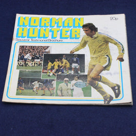Soccer-themed souvenir testimonial brochure featuring a player and images on a blue background