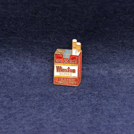 Vintage Winston King Size cigarette‑pack pin with red and white design.