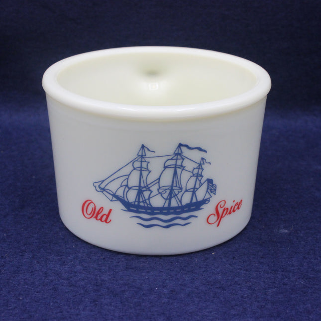 White mug with blue ship design and 'Old Spice' text on a dark blue background