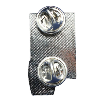 Silver tie clip on a textured blue background
