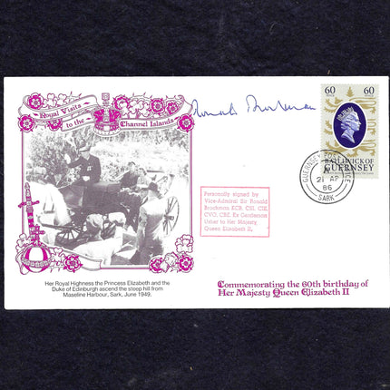 A commemorative envelope or postcard cover from Queen Elizabeth II's 60th birthday, featuring a black-and-white photo of Princess Elizabeth and the Duke, pink decorative border and text, a purple Queen portrait stamp, and a Royal Mail postmark from Knutsford, 1986, shown on a dark textured background.