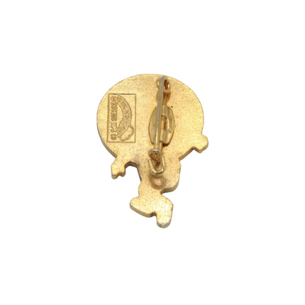A small gold-colored rupert the bear enamel pin or badge shown from the back on a plain light gray background.
