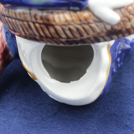 Close-up of a ceramic shell with a textured surface on a blue background