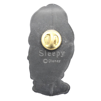 Disney 'Sleepy' character silhouette pin with gold center on a blue textured background