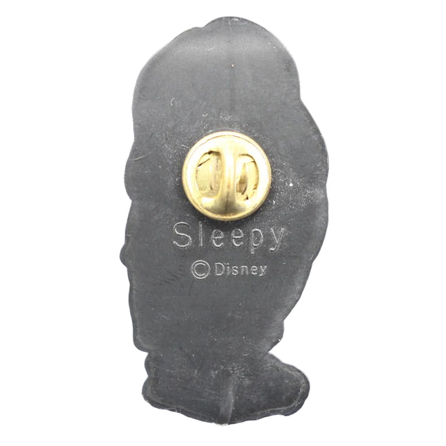 Disney 'Sleepy' character silhouette pin with gold center on a blue textured background