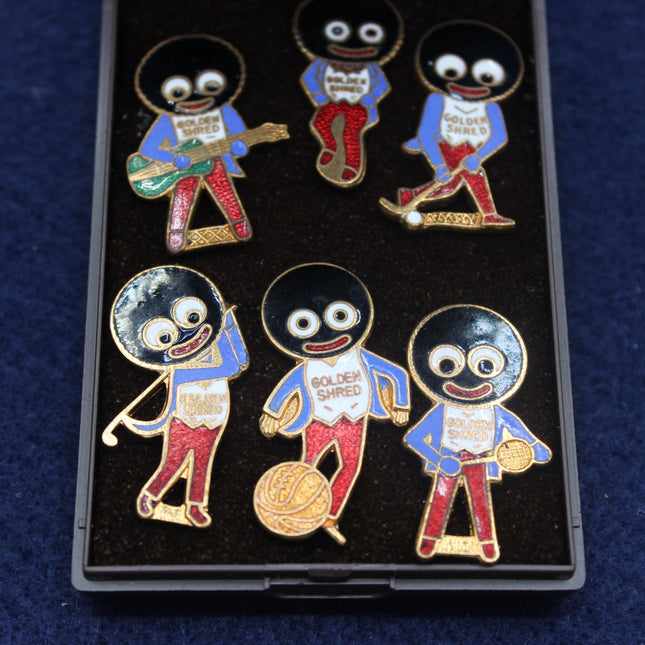 Set of five Robertsons Golly enamel pins featuring a character with a monocle and bow tie on a dark blue background.