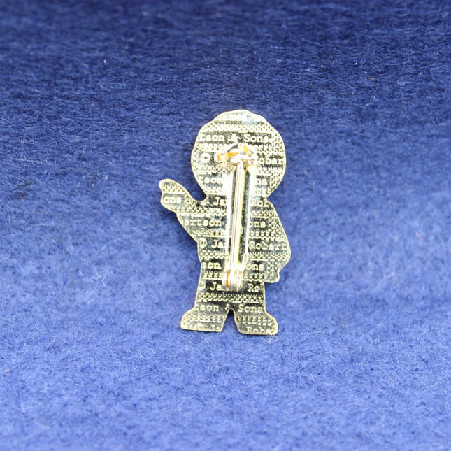 A classic 1990s Robertson’s Golly Standard Golly badge featuring bright enamel colours, prized by collectors of late‑era Golly designs.