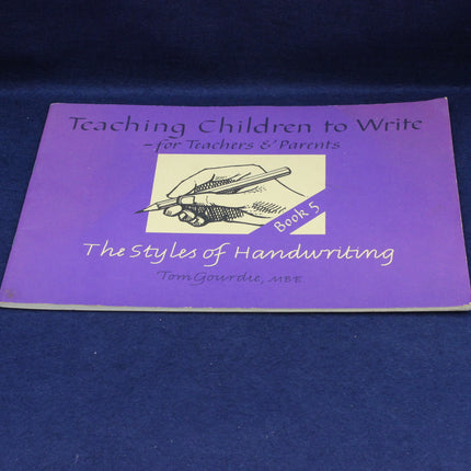 Purple book titled 'Teaching Children to Write' on a blue background