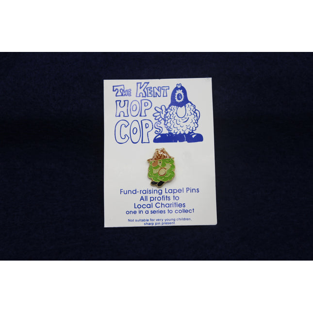 Kent Hop Cops fund-raising lapel pin on a card with a dark background