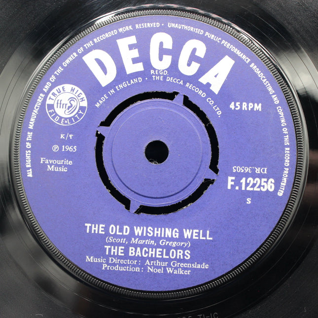 Decca record label with 'The Old Wishing Well' by The Bachelors on a purple label.