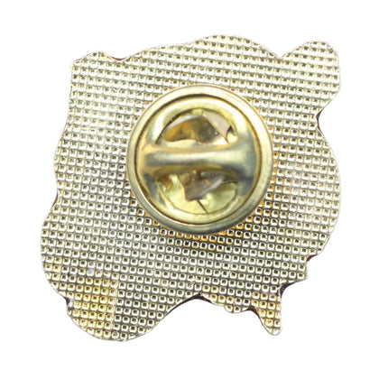 Gold-colored badge or pin on a blue textured background