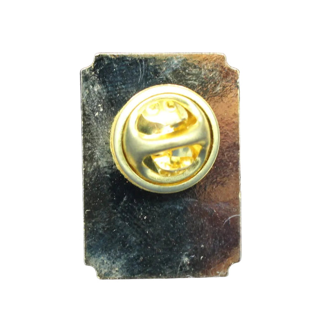 Gold pin on a blue textured background