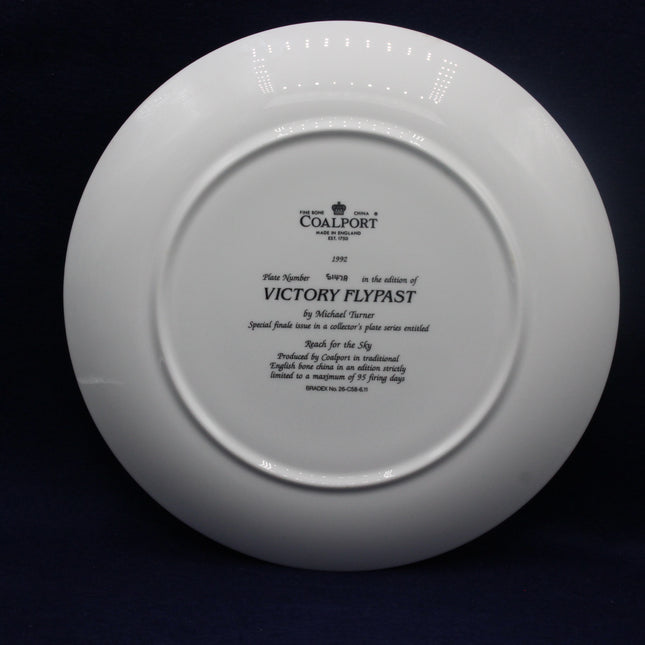 White Coalport plate with engraved text on a black background