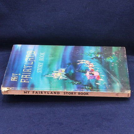 Vintage 'My Fairyland Story Book' on a dark blue background
