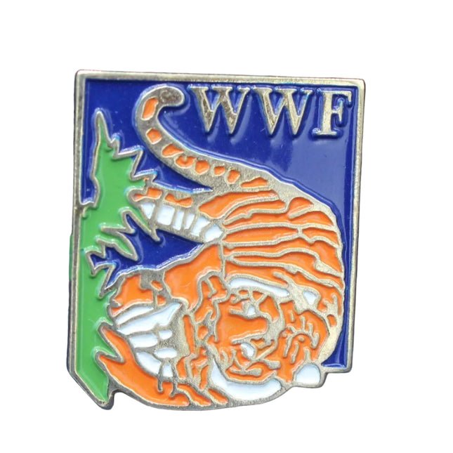 WWF pin on a blue fabric background